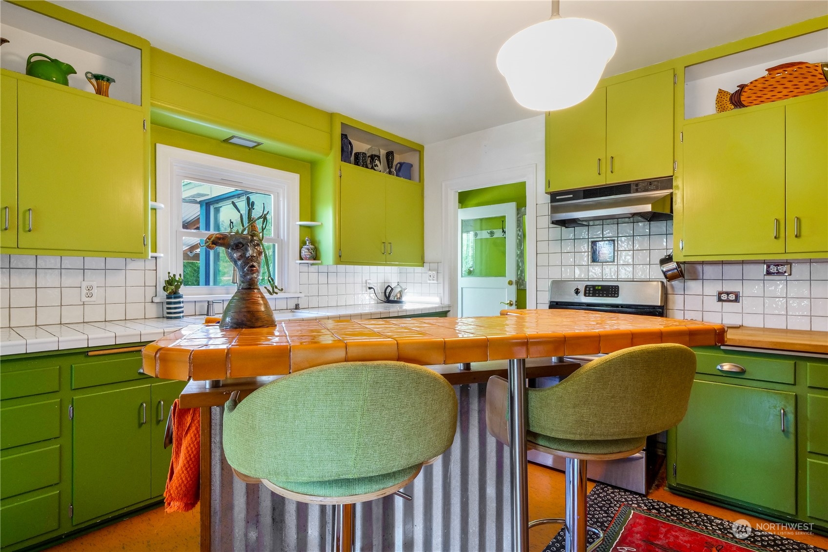 209 West 3rd Avenue Ritzville, WA 99169 - Photo 7 of 31 a view of a kitchen with a table and chairs