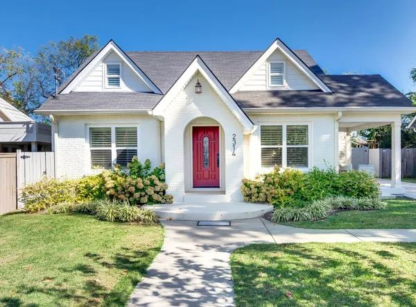 front view of a house with a yard