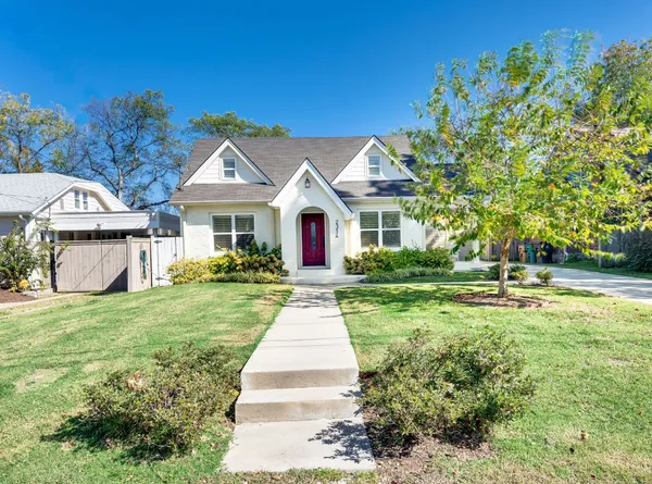 a front view of a house with yard