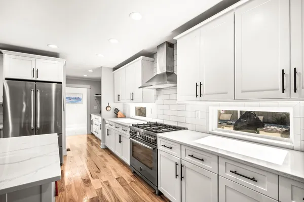 a kitchen with a stove and cabinets