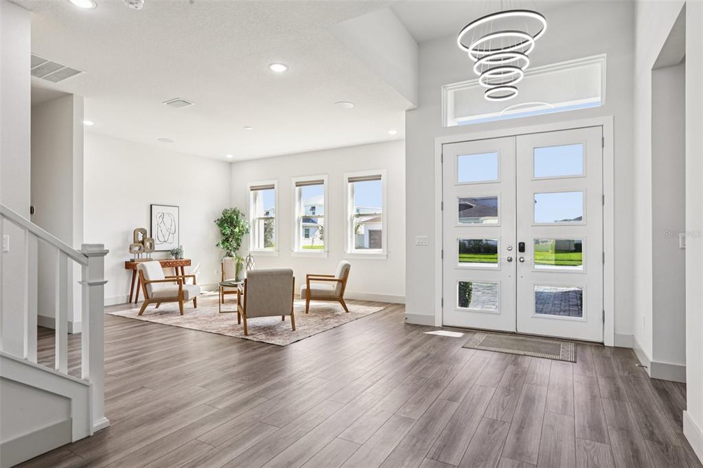 8743 Sanders Tree Loop Wesley Chapel, FL 33545 - Photo 3 of 41 a view of livingroom with furniture and wooden floor