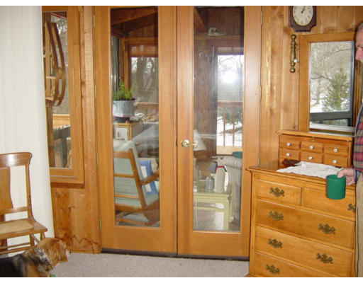 358 W Road Westfield, MA 01085 - Photo 14 of 15 a view of a bathroom with a glass door shower and a mirror