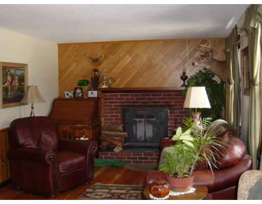 358 W Road Westfield, MA 01085 - Photo 7 of 15 a living room with furniture a window and a fireplace