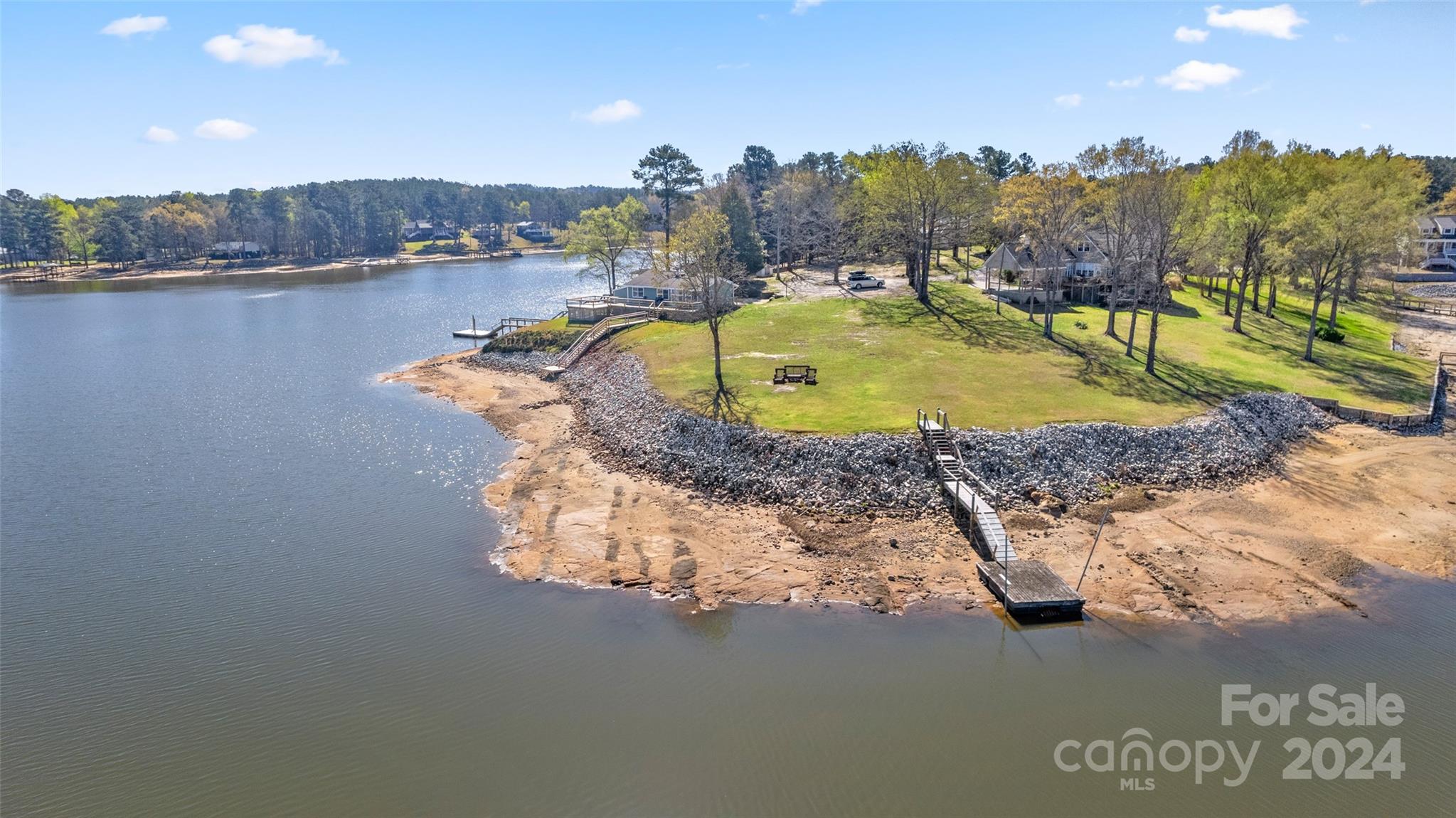 0 Rainbow Cove Ridgeway, SC 29130 - Photo 2 of 10 a view of a lake with a house in the background