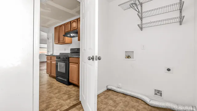 a bathroom with a sink and stainless steel appliances