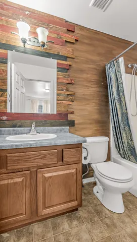 a bathroom with a toilet and a sink