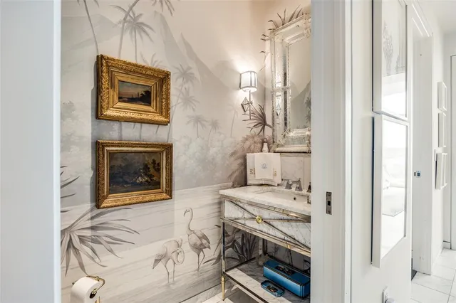 a en suite bathroom with a sink a toilet and a mirror