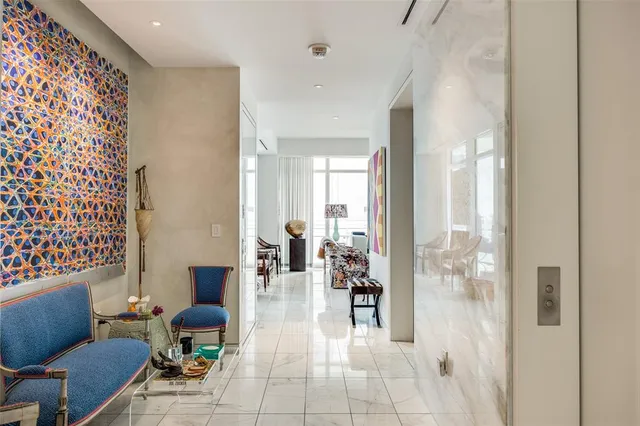 a lobby with furniture and glass door