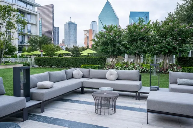 a view of a patio with couches and a big yard