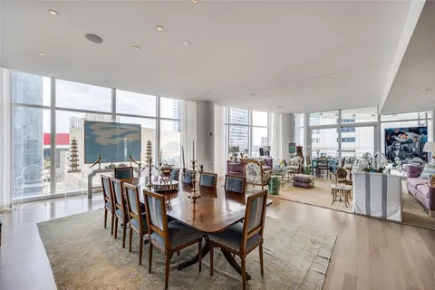 a view of a dining room with furniture window and outside view