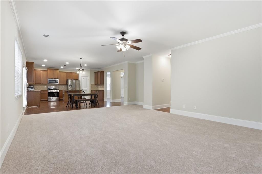1515 Riva Ridge Suwanee, GA 30024 - Photo 11 of 35 a view of a kitchen with a sink and a chandelier