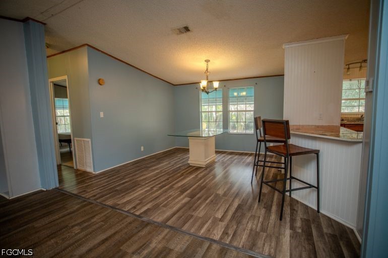 3880 Packinghouse Road Alva, FL 33920 - Photo 25 of 39 a workspace with wooden floor and furniture