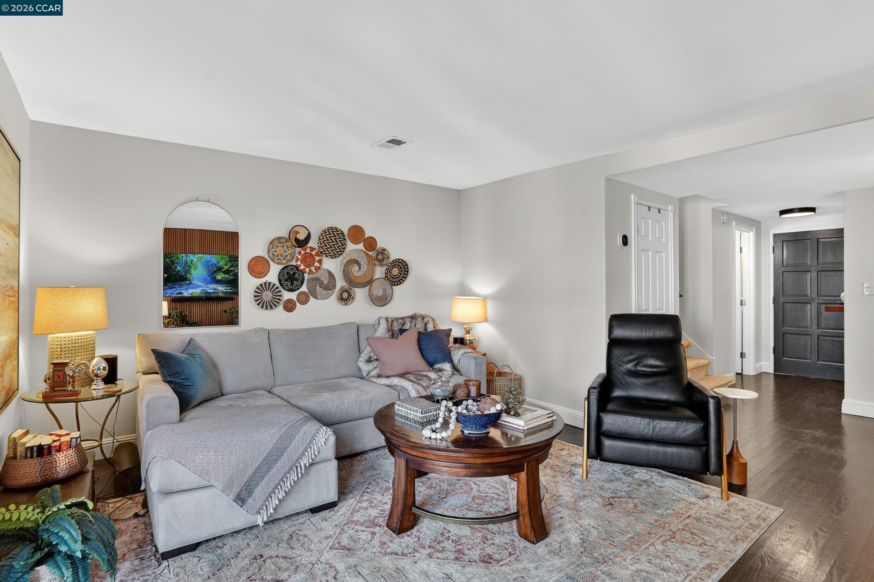1812 Wildbrook Court, Unit C Concord, CA 94521 - Photo 11 of 35 a living room with furniture and wooden floor