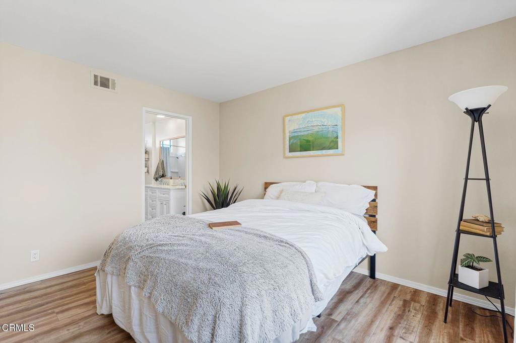 551 South E Street Oxnard, CA 93030 - Photo 10 of 16 a bedroom with a bed and a flat screen tv