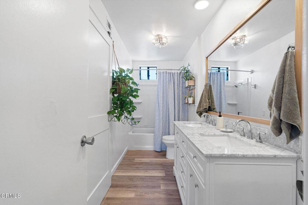 551 South E Street Oxnard, CA 93030 - Photo 11 of 16 a bathroom with a sink and a mirror