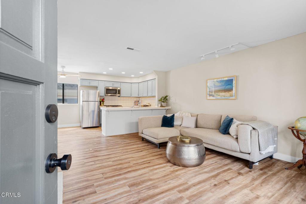 551 South E Street Oxnard, CA 93030 - Photo 2 of 16 a living room with furniture and a wooden floor