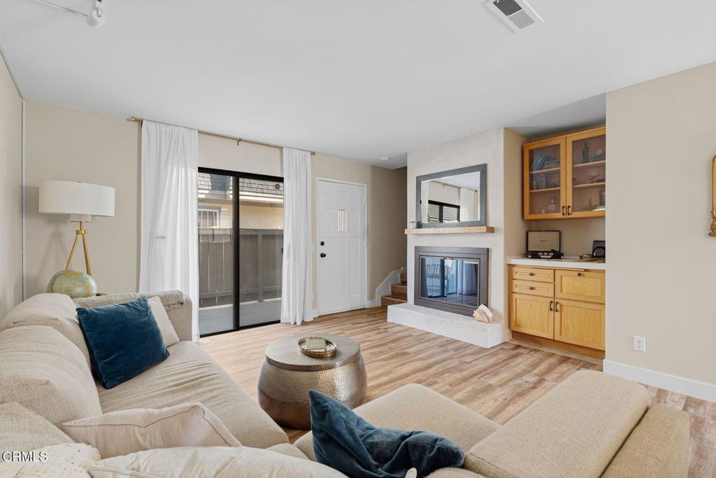 551 South E Street Oxnard, CA 93030 - Photo 3 of 16 a living room with furniture and a kitchen