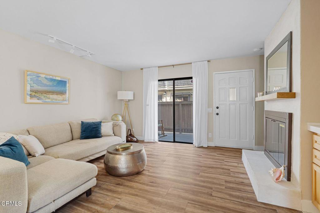 551 South E Street Oxnard, CA 93030 - Photo 4 of 16 a living room with furniture and a fireplace