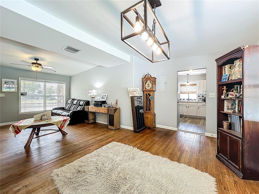 1700 Edmundshire Road Orlando, FL 32812 - Photo 11 of 43 a living room with furniture and wooden floor