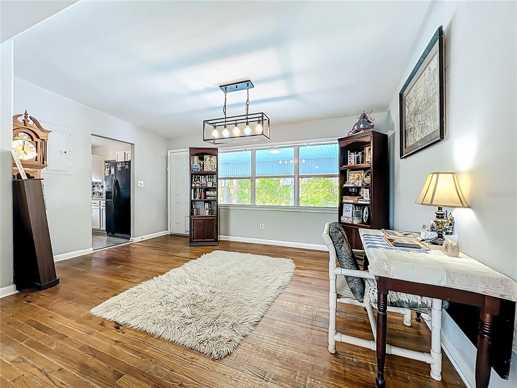 1700 Edmundshire Road Orlando, FL 32812 - Photo 12 of 43 a view of a dining room with furniture and a window