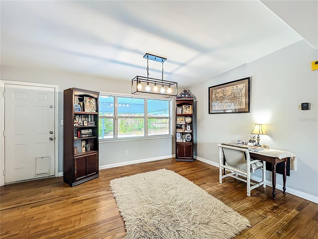 1700 Edmundshire Road Orlando, FL 32812 - Photo 13 of 43 a workspace with furniture window and wooden floor