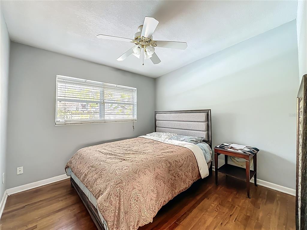 1700 Edmundshire Road Orlando, FL 32812 - Photo 20 of 43 a bedroom with a bed and a window