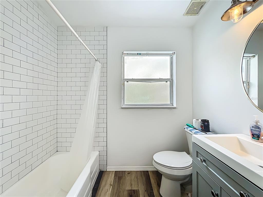 1700 Edmundshire Road Orlando, FL 32812 - Photo 22 of 43 a bathroom with a sink toilet and shower