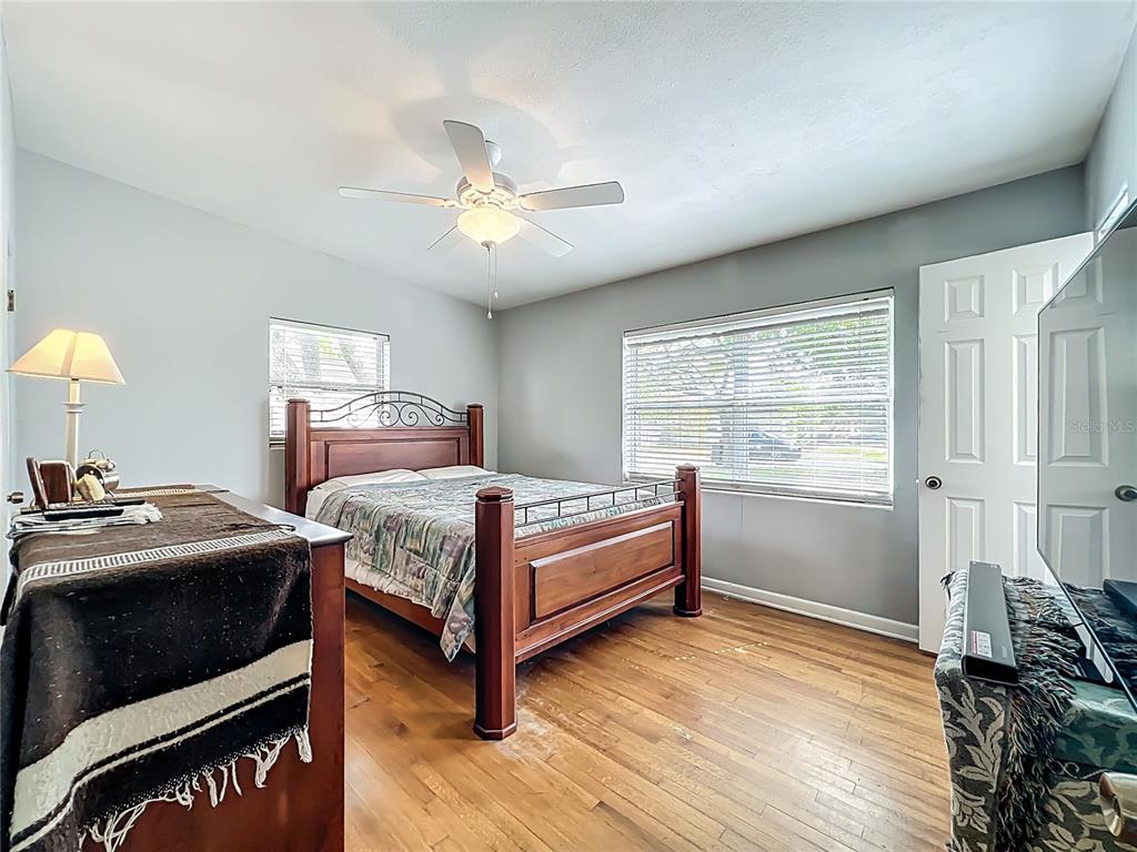 1700 Edmundshire Road Orlando, FL 32812 - Photo 24 of 43 a bedroom with a bed and a window