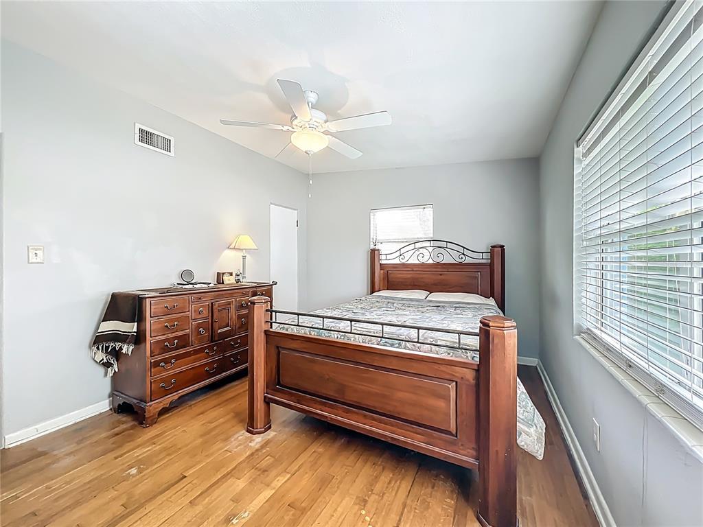 1700 Edmundshire Road Orlando, FL 32812 - Photo 25 of 43 a bedroom with furniture and wooden floor