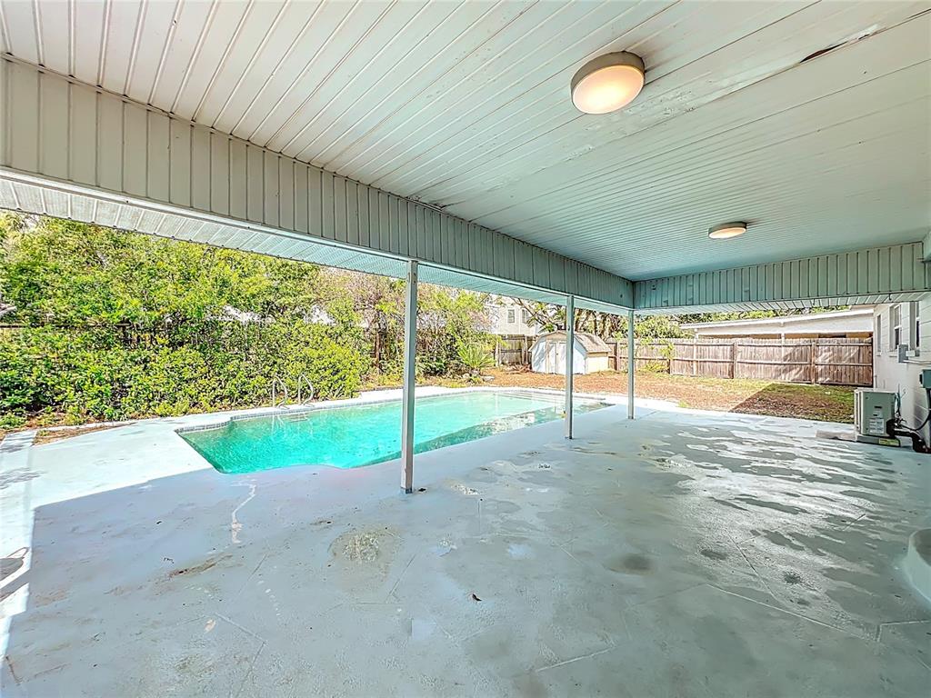 1700 Edmundshire Road Orlando, FL 32812 - Photo 31 of 43 a view of an empty room with window and a ceiling fan