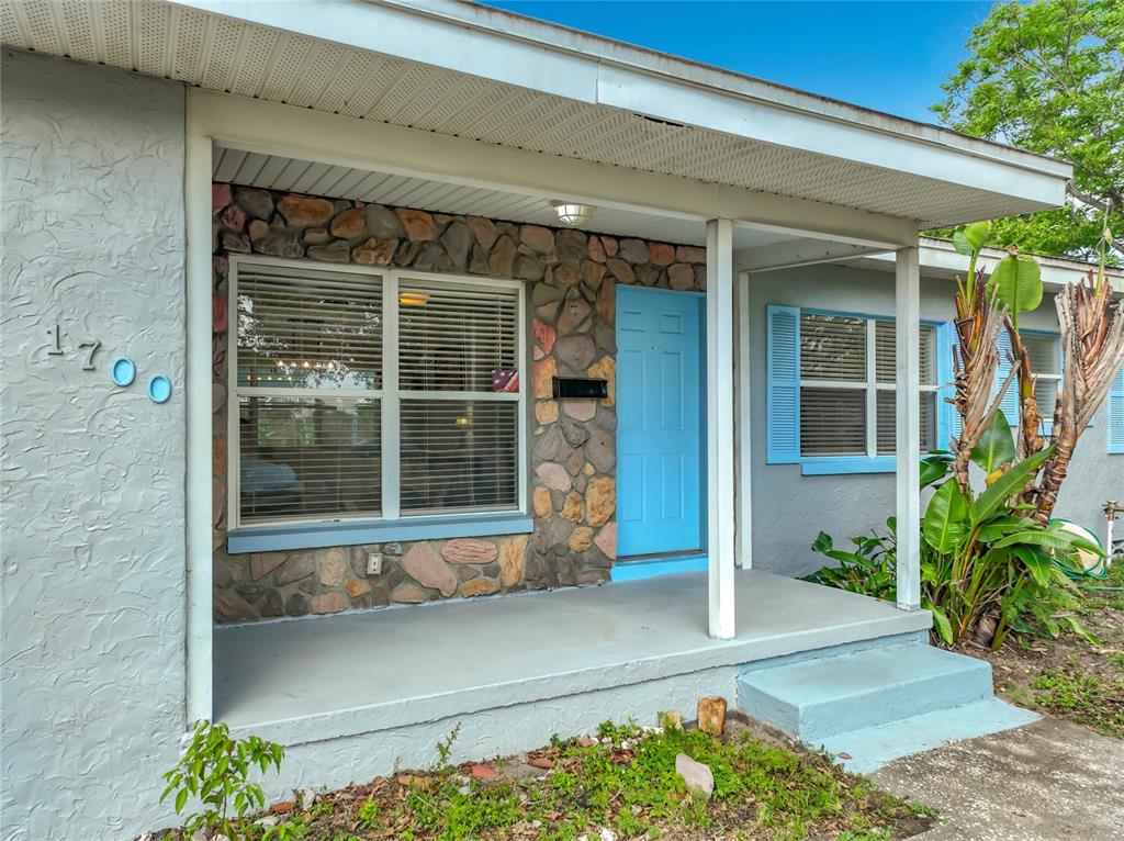 1700 Edmundshire Road Orlando, FL 32812 - Photo 4 of 43 a front view of a house with a yard