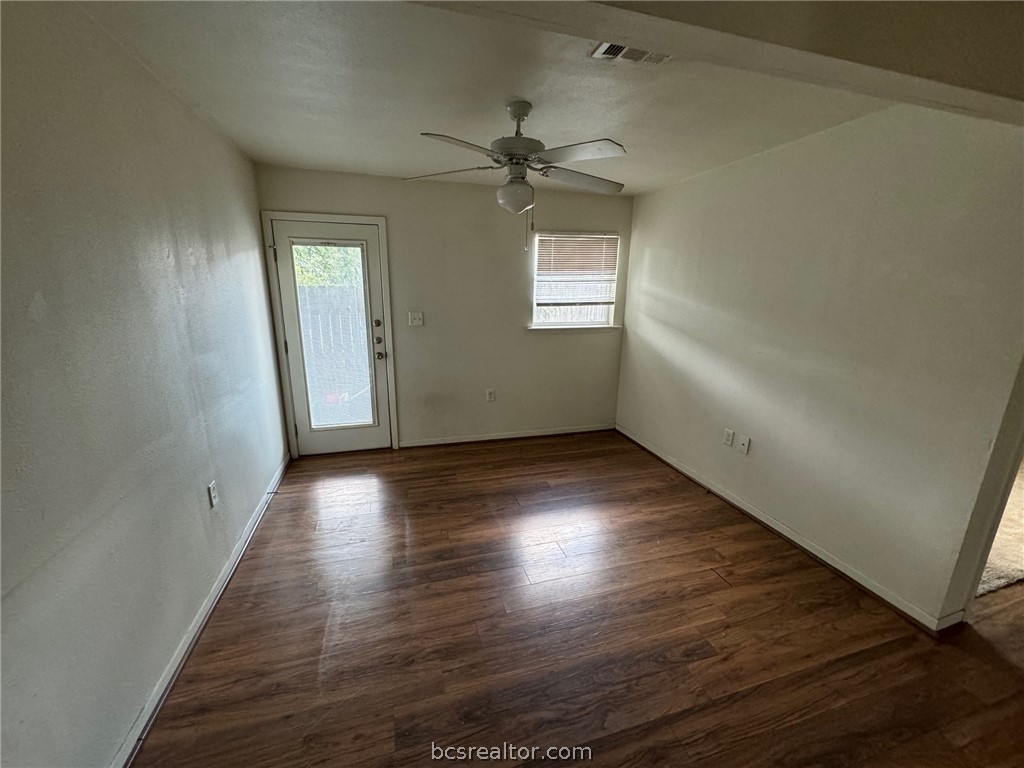 1710 Echols Street, Unit 3 Bryan, TX 77801 - Photo 2 of 5 an empty room with wooden floor closet and windows