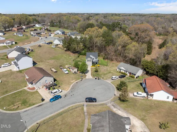 an aerial view of a house with outdoor space