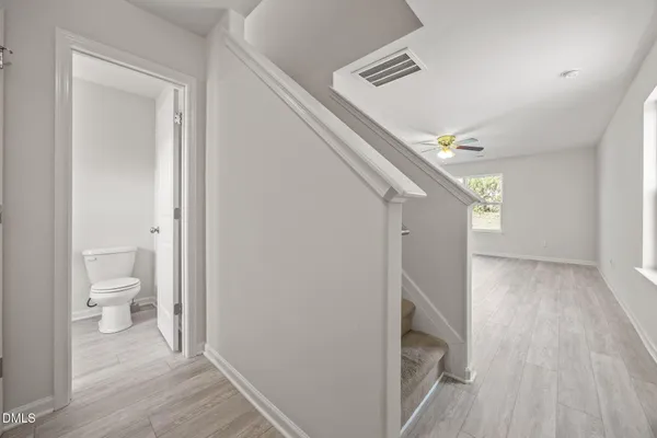 a view of a bathroom from the hallway