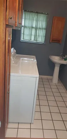 a utility room with dryer and washer