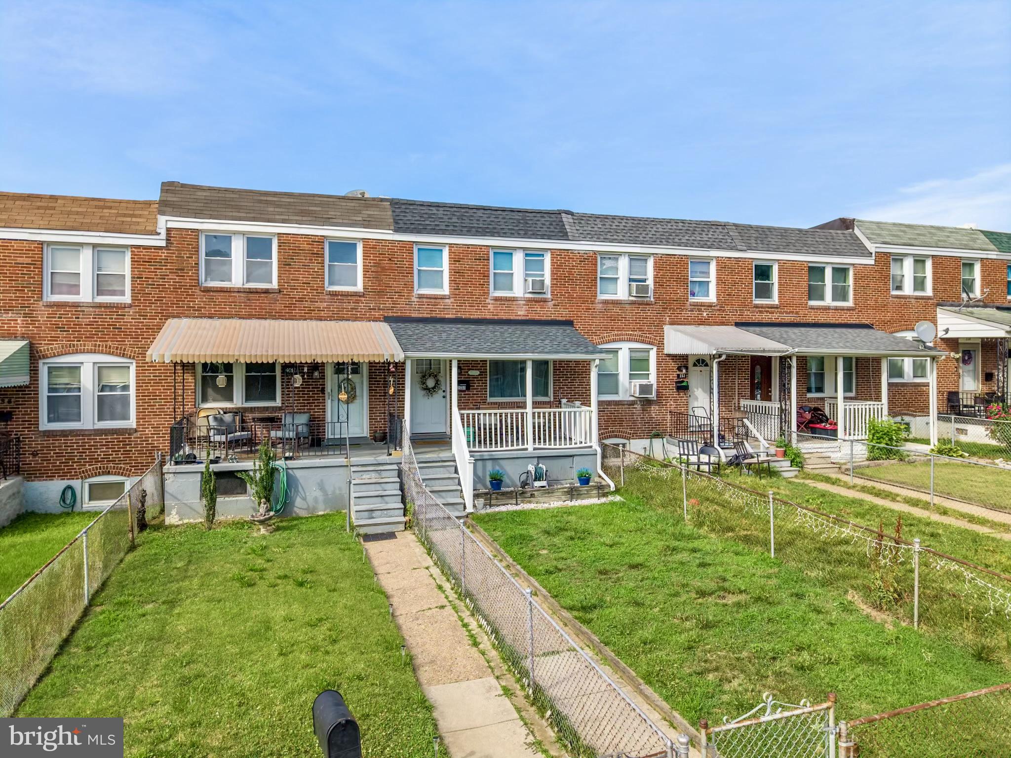 234 West Edgevale Road Baltimore, MD 21225 - Photo 33 of 45 Charming row homes with green lawns.