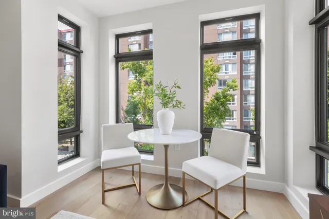 a view of a dining room with furniture window and wooden floor
