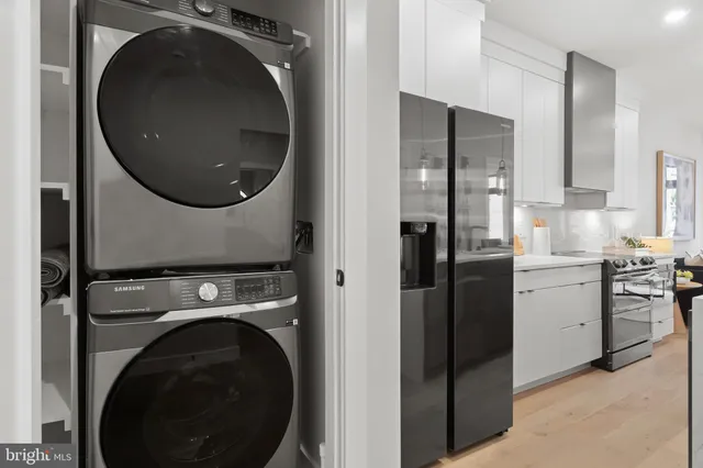 a view of a kitchen with washer and dryer