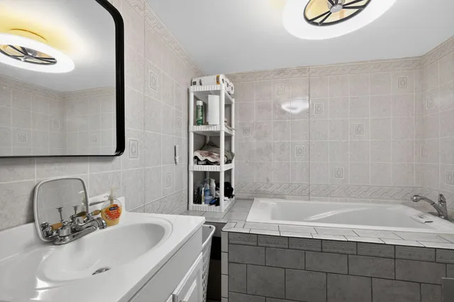 a white toilet sitting next to a bathroom sink