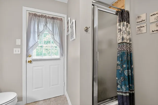 a bathroom with a double vanity sink and mirror