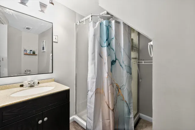 a view of a two chairs in a backyard