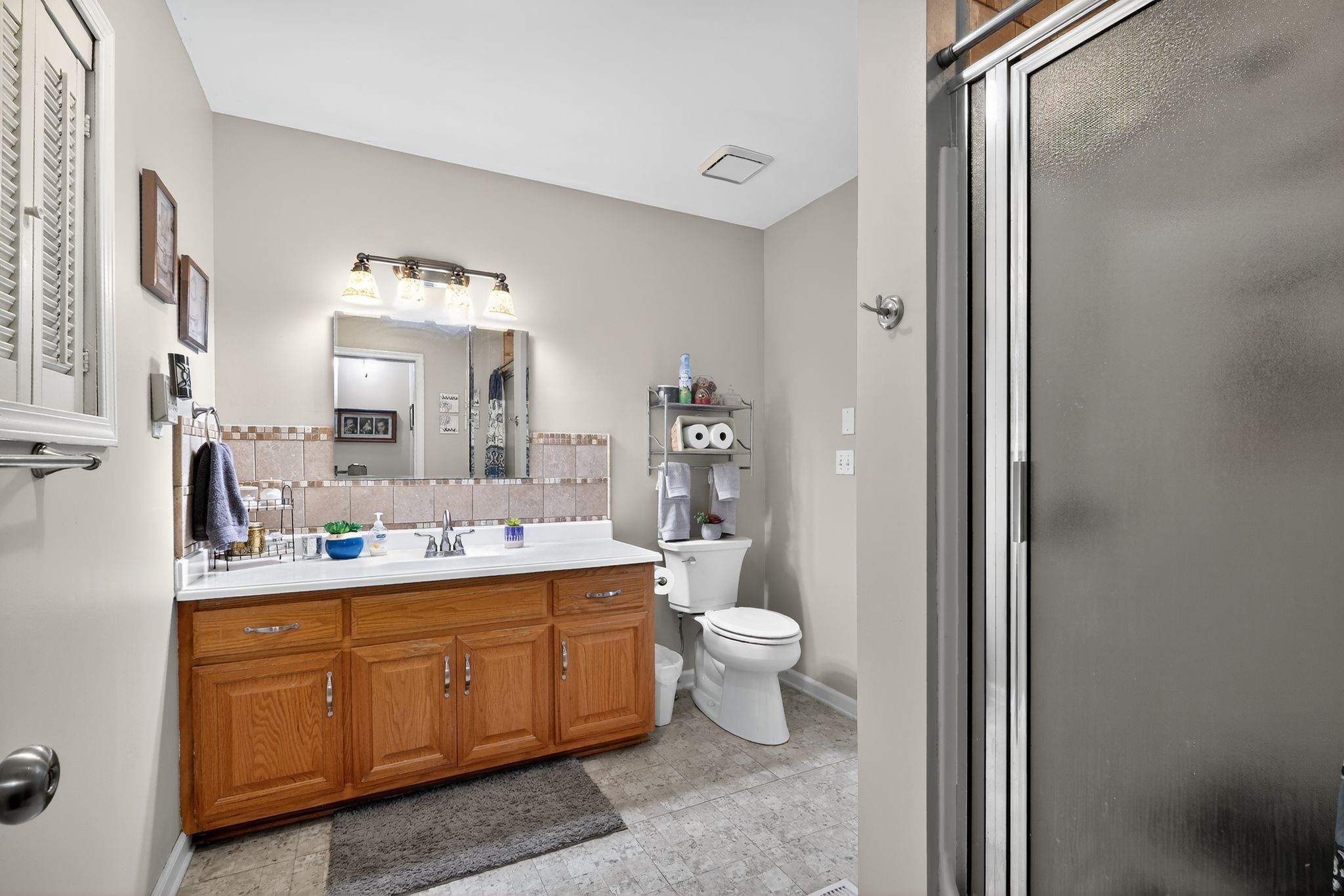 3119 Tyree Springs Road Hendersonville, TN 37075 - Photo 27 of 61 a bathroom with a double vanity sink mirror and toilet