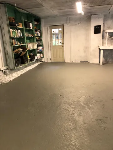 a view of a two chairs in a backyard