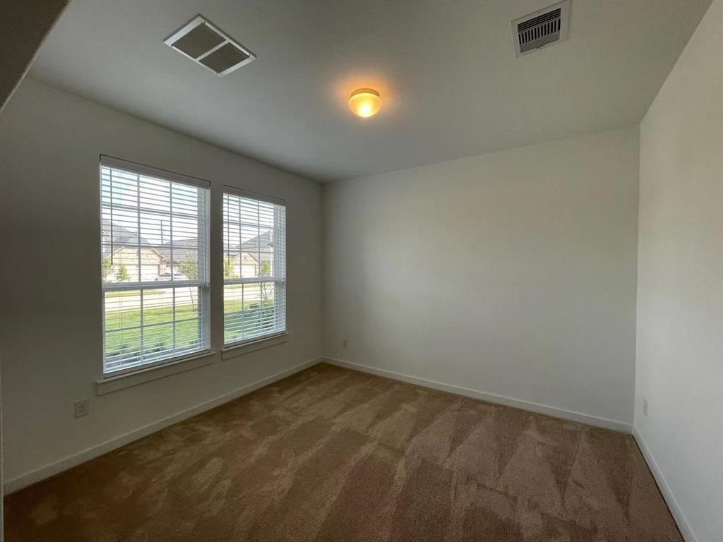 815 Summer Village Way Rosenberg, TX 77469 - Photo 3 of 21 an empty room with a window