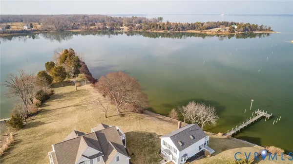 a kitchen with granite countertop wooden cabinets and white appliances