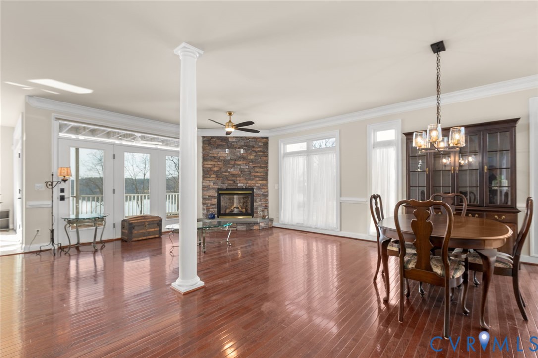 175 Shellfield Lane Colonial Beach, VA 22443 - Photo 18 of 100 a view of a dining room and livingroom with furniture wooden floor a chandelier