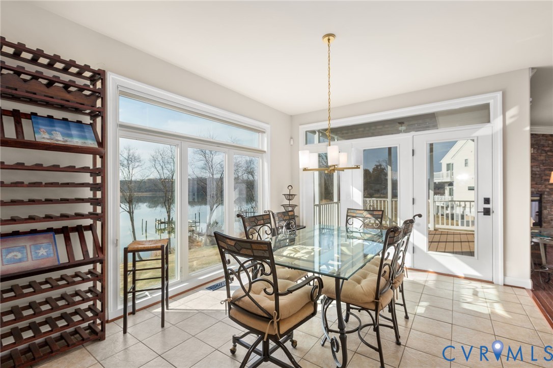 175 Shellfield Lane Colonial Beach, VA 22443 - Photo 25 of 100 a view of a dining room with furniture window and wooden floor