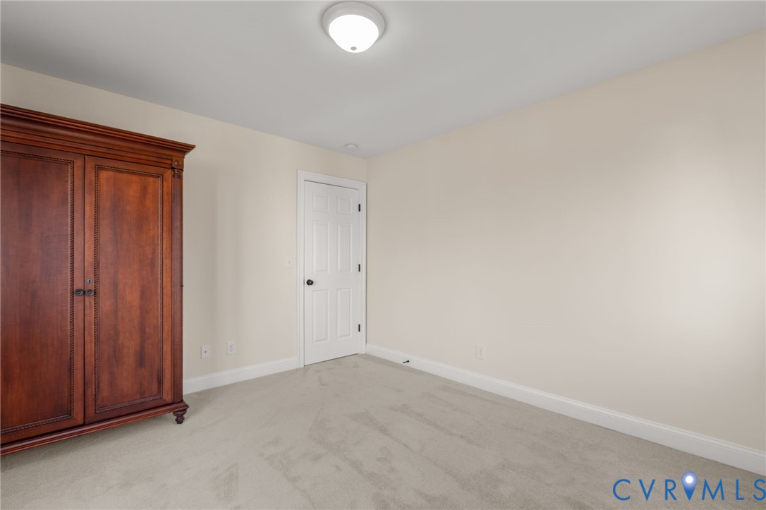 175 Shellfield Lane Colonial Beach, VA 22443 - Photo 35 of 100 Unfurnished bedroom featuring light carpet and bas