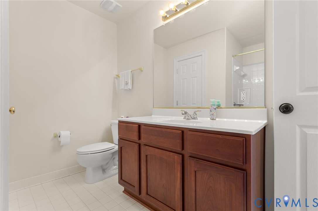 175 Shellfield Lane Colonial Beach, VA 22443 - Photo 40 of 100 a bathroom with a sink toilet and mirror
