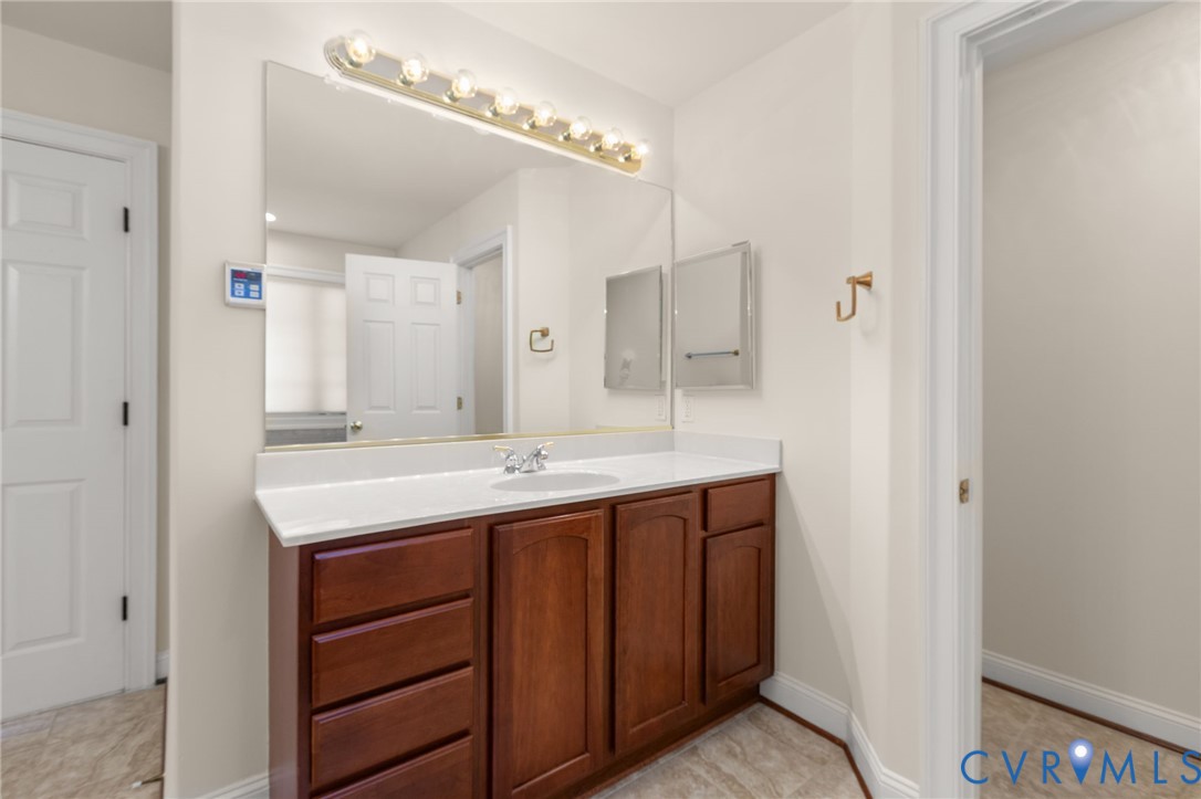 175 Shellfield Lane Colonial Beach, VA 22443 - Photo 52 of 100 a bathroom with a double vanity sink and a mirror